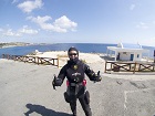 diver wears a drysuit for the winter diving in Cyprus. Goes well with the sunglasses